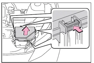 Subaru Solterra fuse box in motor compartment opening tab and lid removal