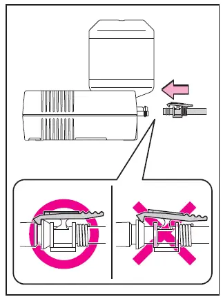 Subaru Solterra attaching hose to sealant bottle connection point