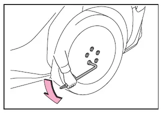 Subaru Solterra loosening wheel bolts before lifting vehicle