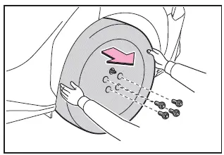 Subaru Solterra removing tire and placing wheel safely on ground